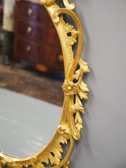 Antique Carved Wood and Gilded Oval Mirror