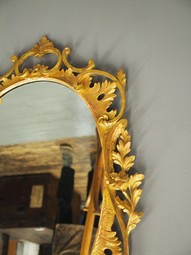 Antique Adams Style Carved Wood and Gilded Oval Mirror