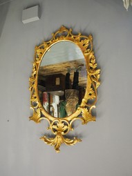 Antique Adams Style Carved Wood and Gilded Oval Mirror