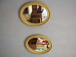 Antique Pair of Gilded Adams Style Oval Mirrors