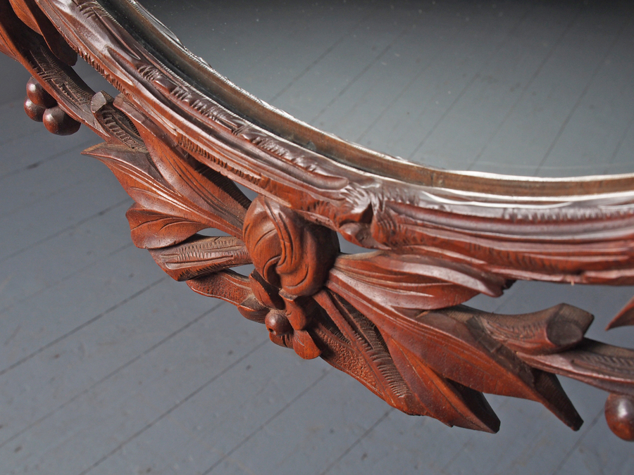 Antique Carved Black Forest Walnut Wall Mirror