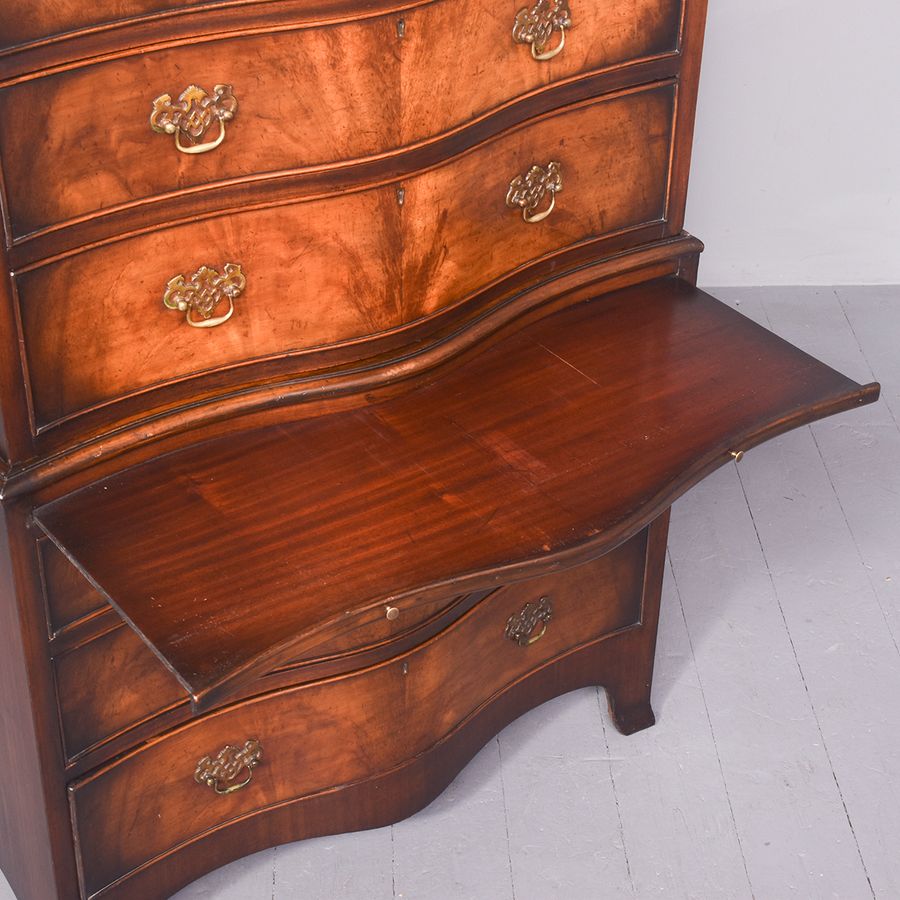 Antique George III style neat sized serpentine front mahogany chest on chest