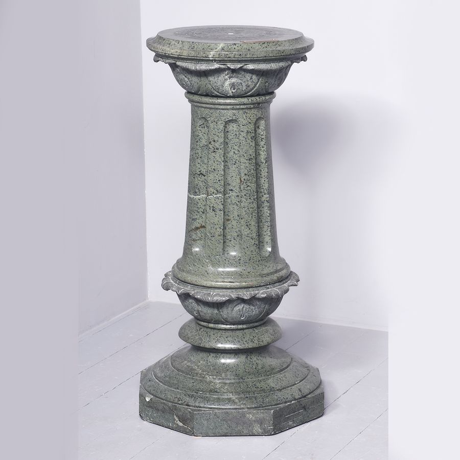 A Serpentine Pedestal with Revolving Top