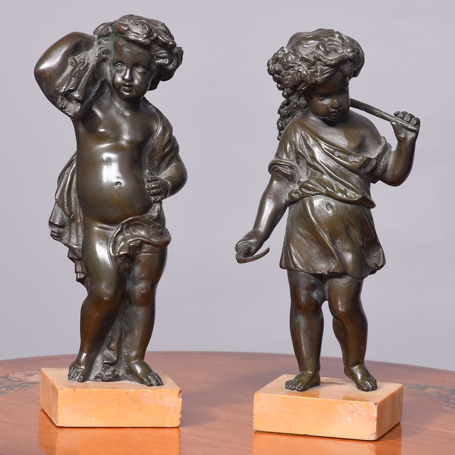 A Pair of French Patinated Allegorical Bronze Figures of Putti At Harvest Time