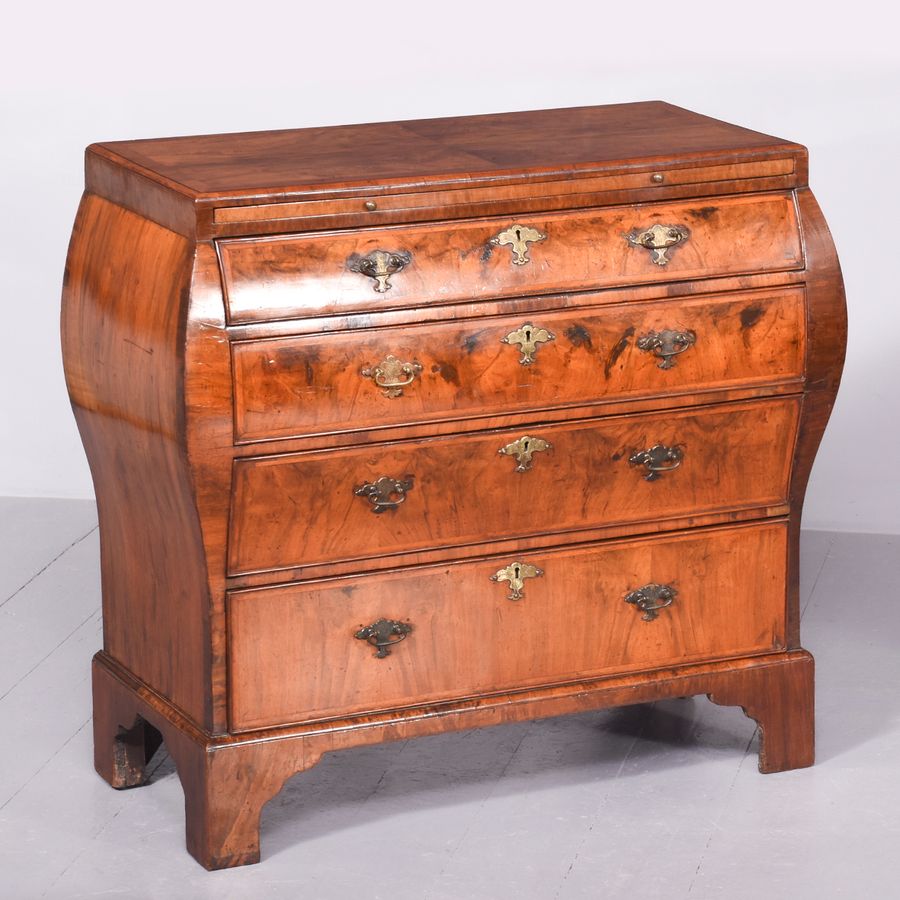 Early 19th Century Dutch Crossbanded Walnut Bombe-Front Chest Of Drawers With Brushing Slide