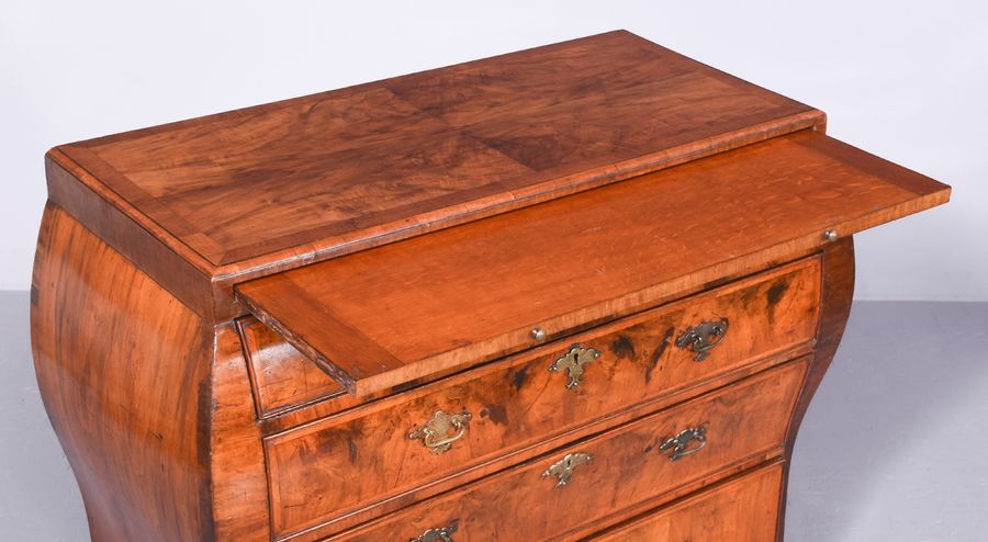 Antique Early 19th Century Dutch Crossbanded Walnut Bombe-Front Chest Of Drawers With Brushing Slide