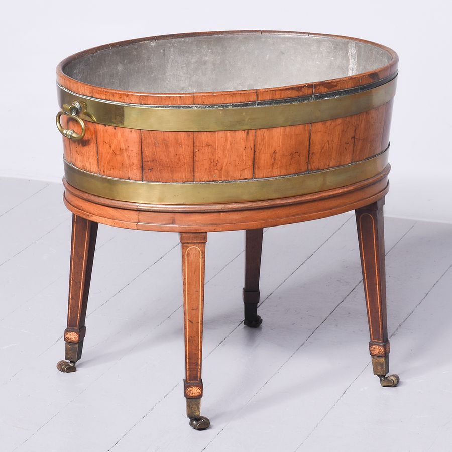 George III brass-bound, oval open wine cooler on stand with original zinc liner