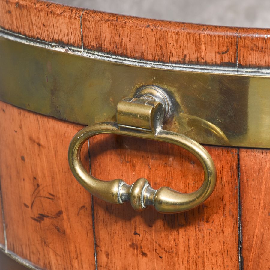 Antique George III brass-bound, oval open wine cooler on stand with original zinc liner