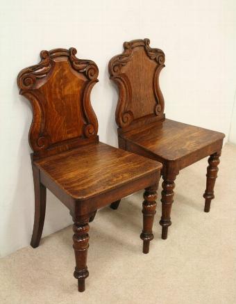 Pair of Early Victorian Carved Oak Hall Chairs