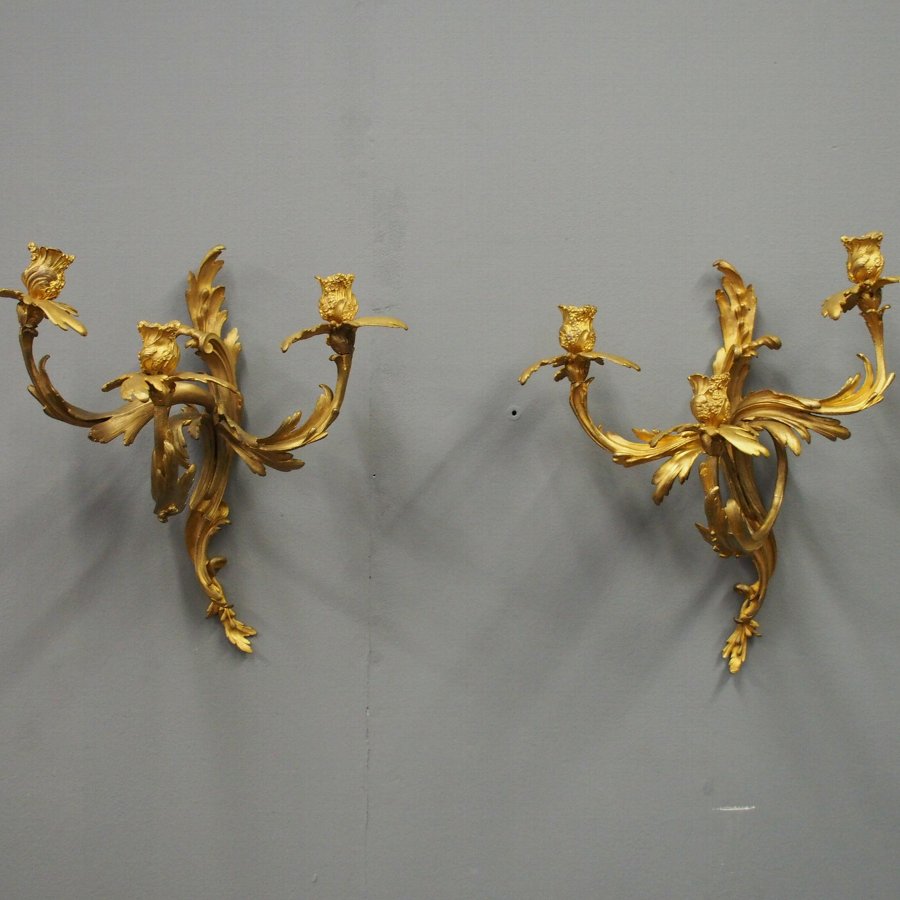 Antique Pair of Louis XV Style Cast Brass and Gilded Sconces