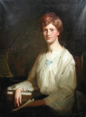 Portrait of Ella Mcleod seated at a piano holding a musical score