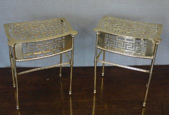 A pair of brass fireside trivets or footmen