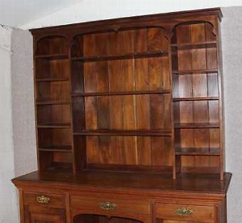 Antique 1920's Large decorative Carved Walnut Dresser with display rack and cupboards.