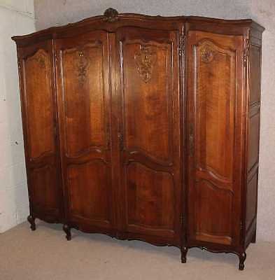 French Louis XV style Carved Walnut 4 Door Armoire All Hanging.
