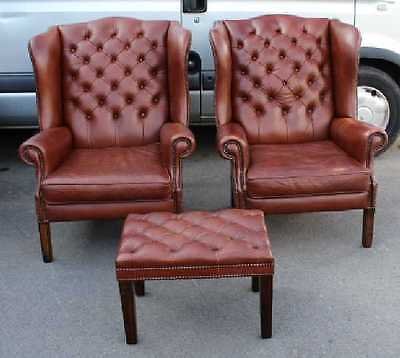 Pair of Large Brown Leather buttoned Wing Back armchairs with matching Stool.