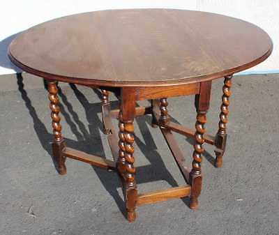 Antique 1920's Oak Gate Leg Table with carved turned legs. Great for a Project