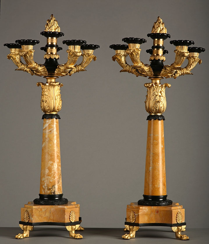 A pair of five lights candelabras in gilt and patinated bronze and Sienna marble