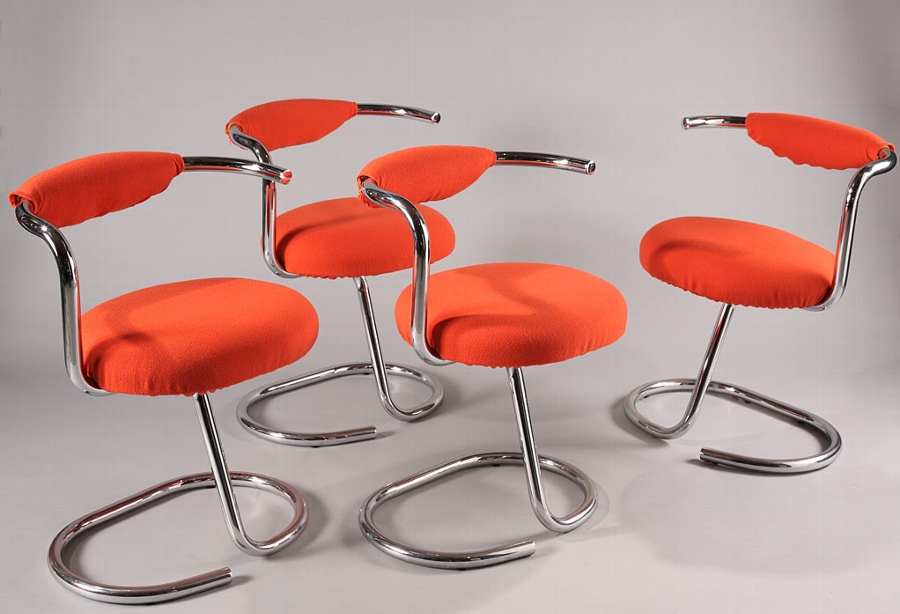 Four tubular chromed metal chairs