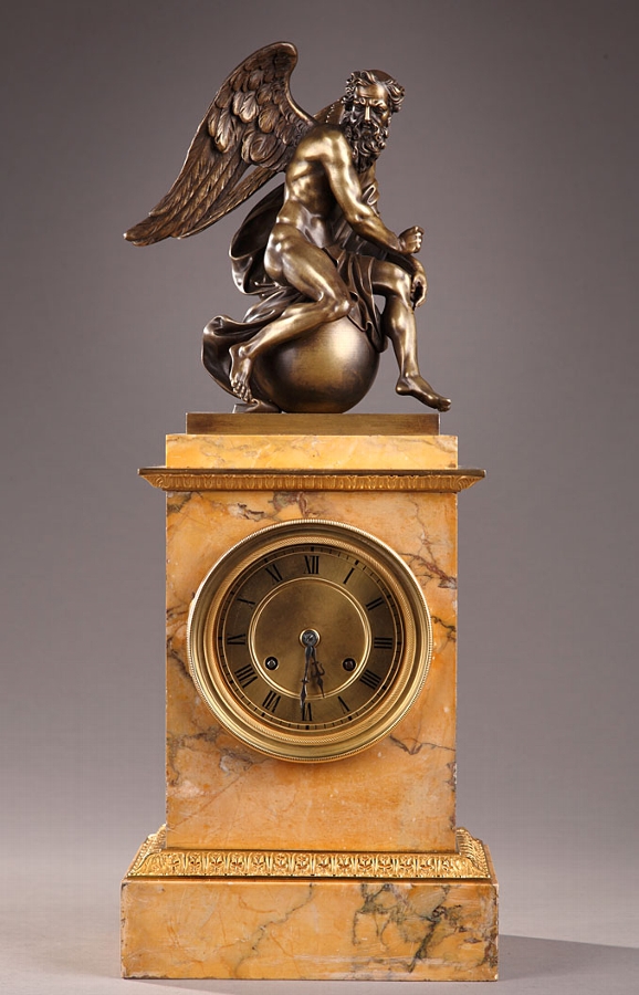 French 19th century mantle clock in Sienna marble and a bronze sculpture of Chronos