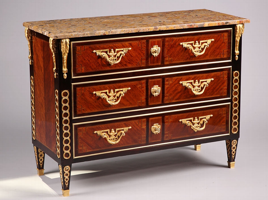A French 19TH Century neo-classic Louis XVI style commode with rich gilded bronze mounts