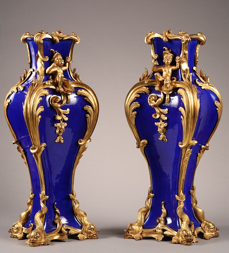 A pair of Louis XV style ormolu mounted blue porcelain vases