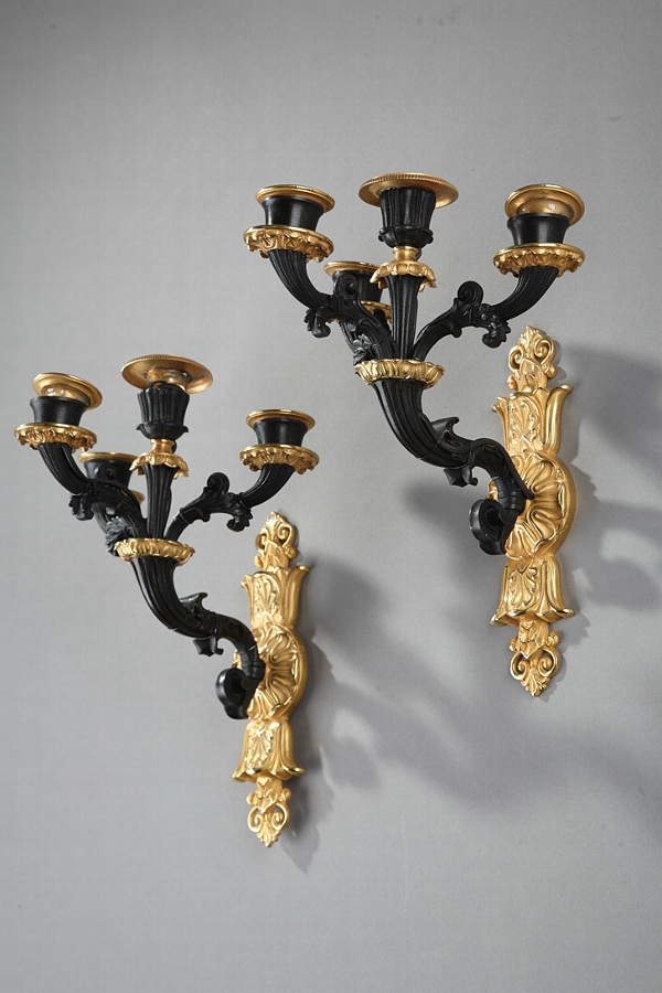 Pair of French Restauration Period four lights bronze sconces