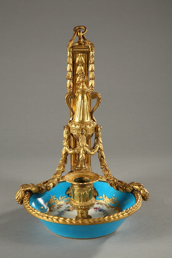 An eighteenth century candle holder in Sevres porcelain and ormolu mounts