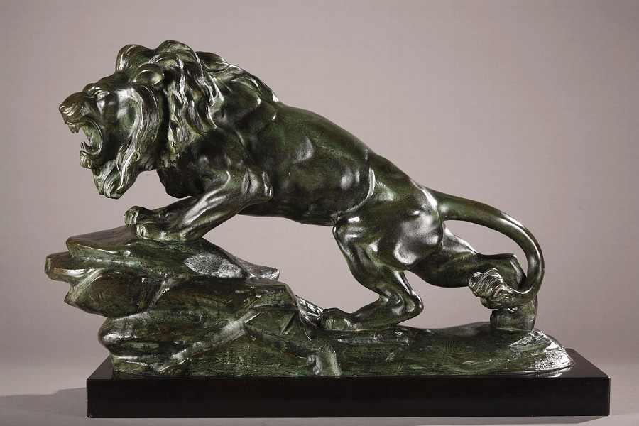 An Art Deco bronze sculpture of a roaring lion signed Nerid.