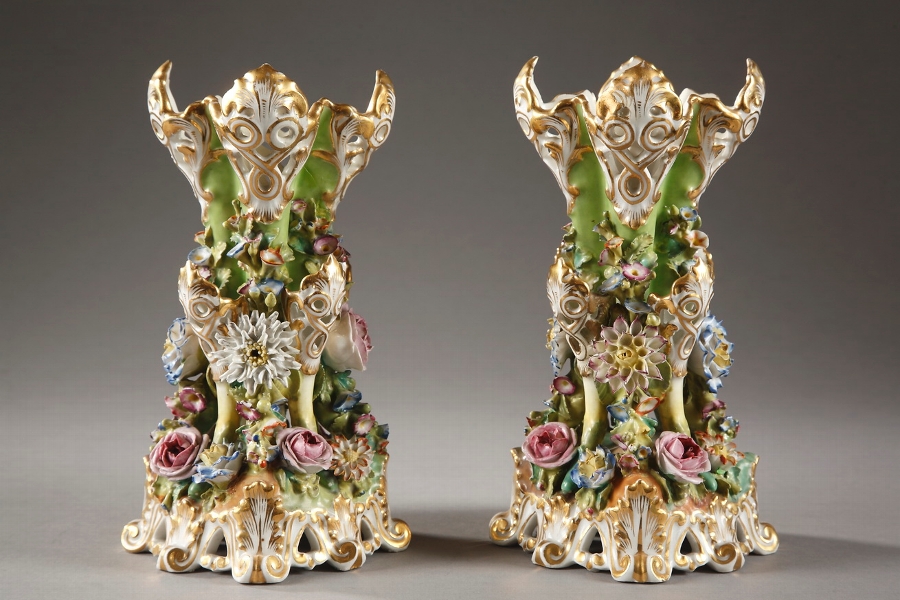 Pair of polychrome porcelain vases decorated with flowers in high relief on green background signed Jacob Petit