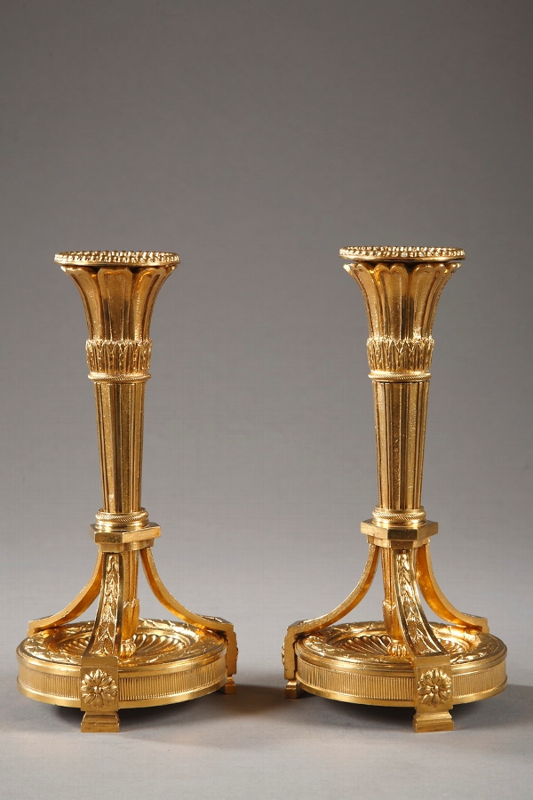 Pair of gilt bronze Louis XVI style candlesticks