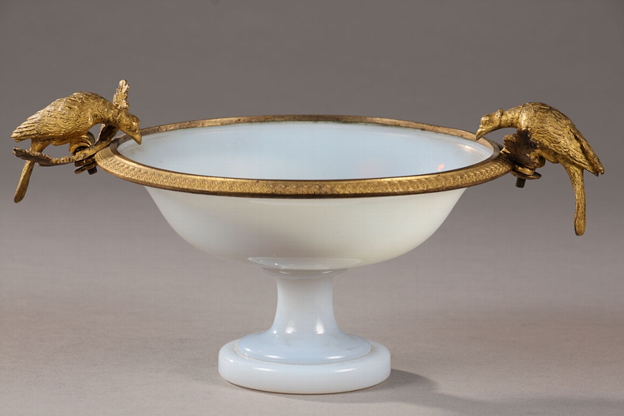A white opaline Charles X cup with birds