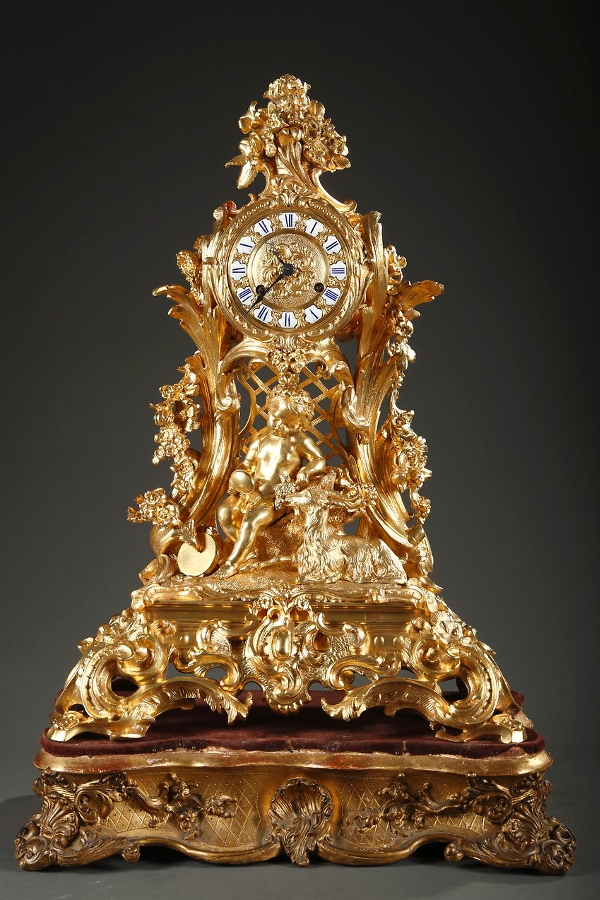 Gilt bronze mantle clock in rococo style with Bacchus and a goat
