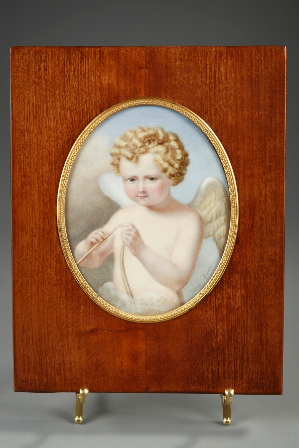 Late 19th century porcelain plate with a child portrayed as a winged Cupid