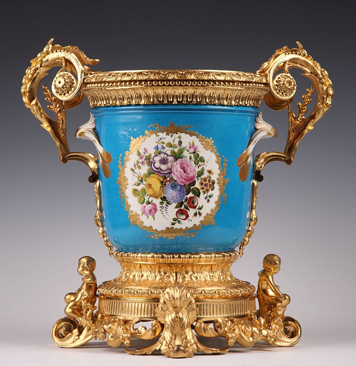 A French 18th century pair of porcelain vases with 19th century gilt bronze mounts