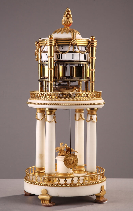 A Louis XVI marble and ormolu temple shape mantel clock