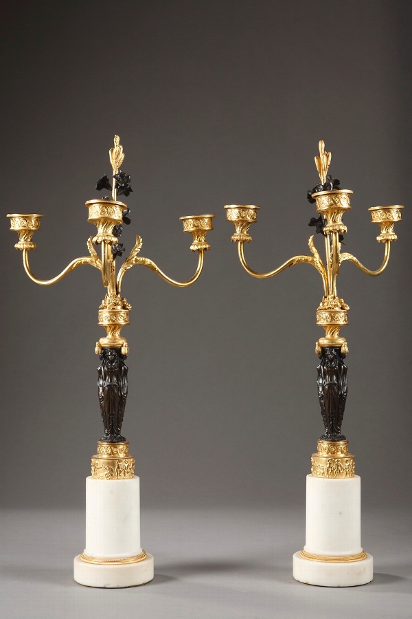 A French early 19th century pair of candelabras with caryatids