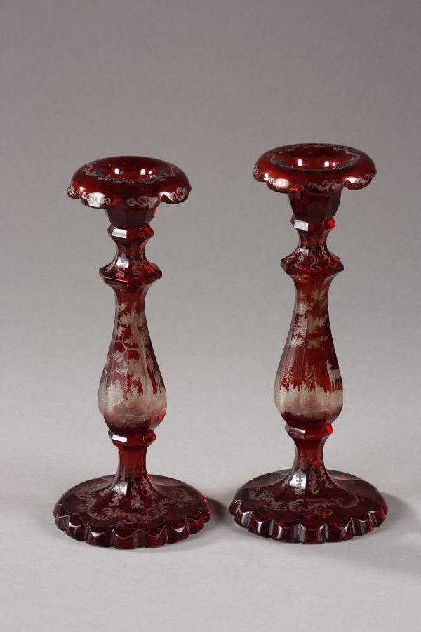 A pair of Bohemia red crystal candlesticks