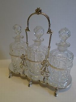 Antique Antique English Figural Tantalus in Silver Plate With Cut Crystal Decanters