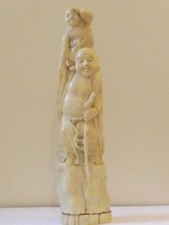 A Large Japanese Ivory Okimono of a Buddha Standing Holding a Child C1890 Meiji Period  28.5cm He...
