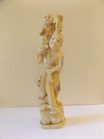 A Japanese Ivory Okimono of a Fisherman Holding a Boy on his Shoulders c1890 Meiji Period 21cm Hi...