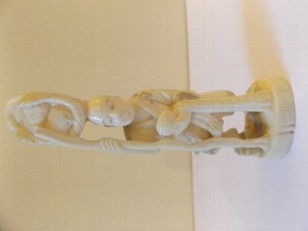 Japanese Ivory Okimono Of a Man Carrying Baskets c1900