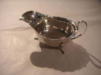 SILVER SAUCE BOAT WITH SCALLOPED EDGE ON THREE FEET BY VINERS 1937