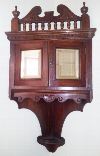 Edwardian mahogany mirror-door corner cabinet