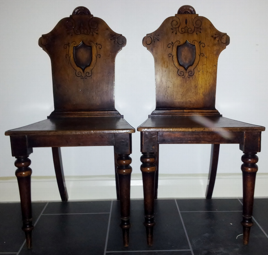 Antique Pair of carved oak hall chairs
