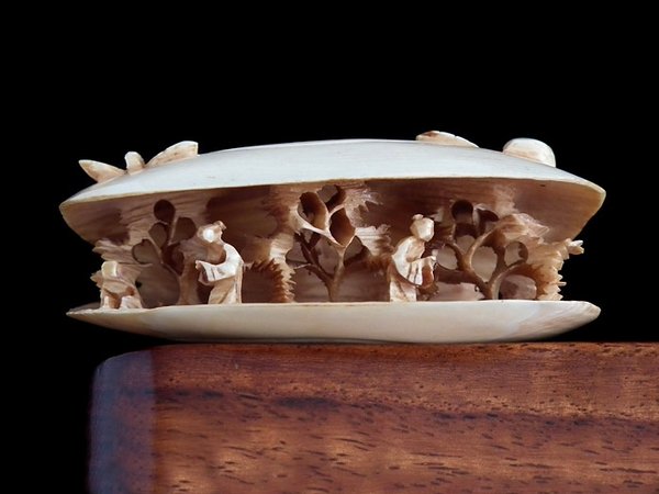 Chinese ox bone hand carved 'world in a clam' - c1800s