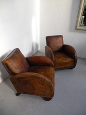 Pair of 1930's deco styled leather club chairs in good condition