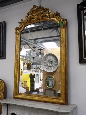 Mid 1800's water gilded French mirror with crest, original mirror glass 