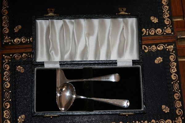 A Silver Baby Spoon and Pusher