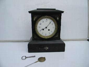 Mantle Clock Victorian 8 day mechanical movement chimes on the Half and hours.