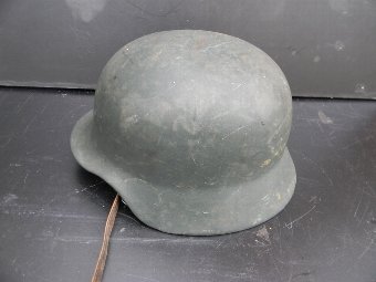 Antique German Helmet with liner and chin strap. 